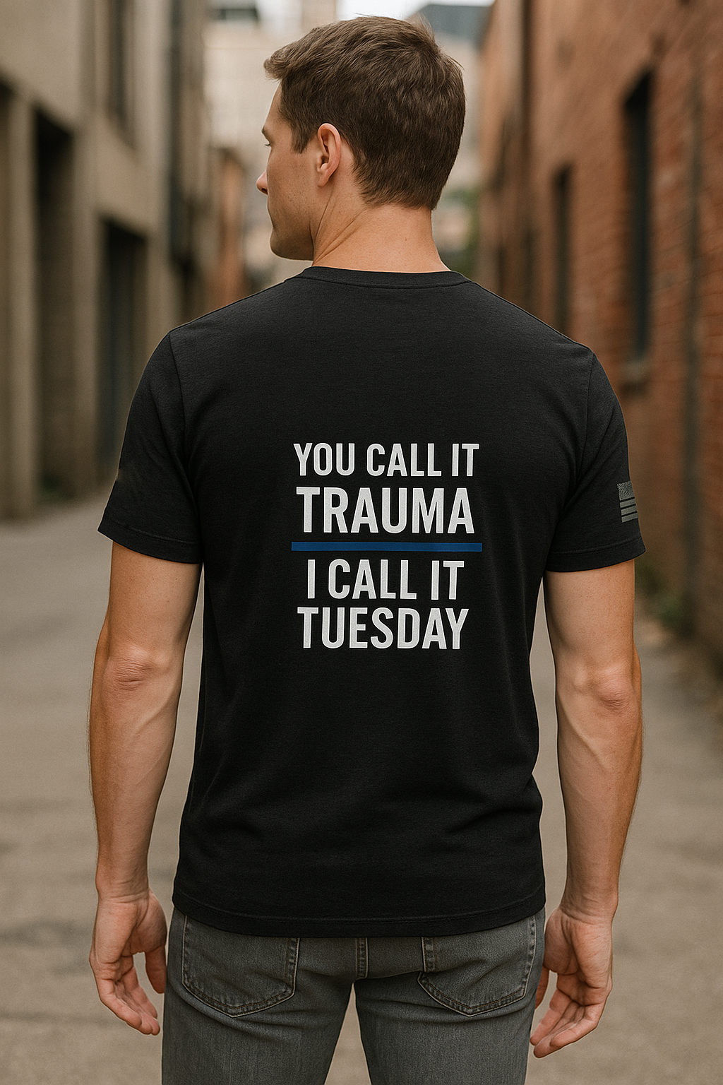 Man wearing Call Sign Gear T-shirt with blue line in urban environement